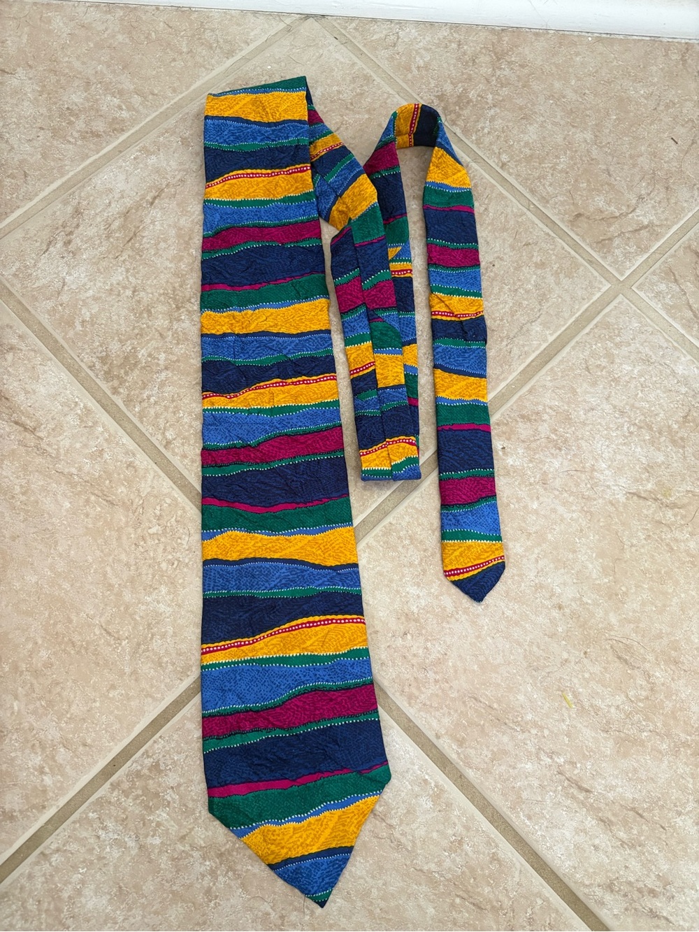 Coogi multicolor 100% silk necktie featuring a textured geometric pattern